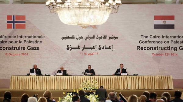 Egypt's Foreign Minister Shoukry, Palestinian President Abbas, Egyptian President Sisi and Norway's Foreign Minister Brende attend a Gaza reconstruction conference in Cairo