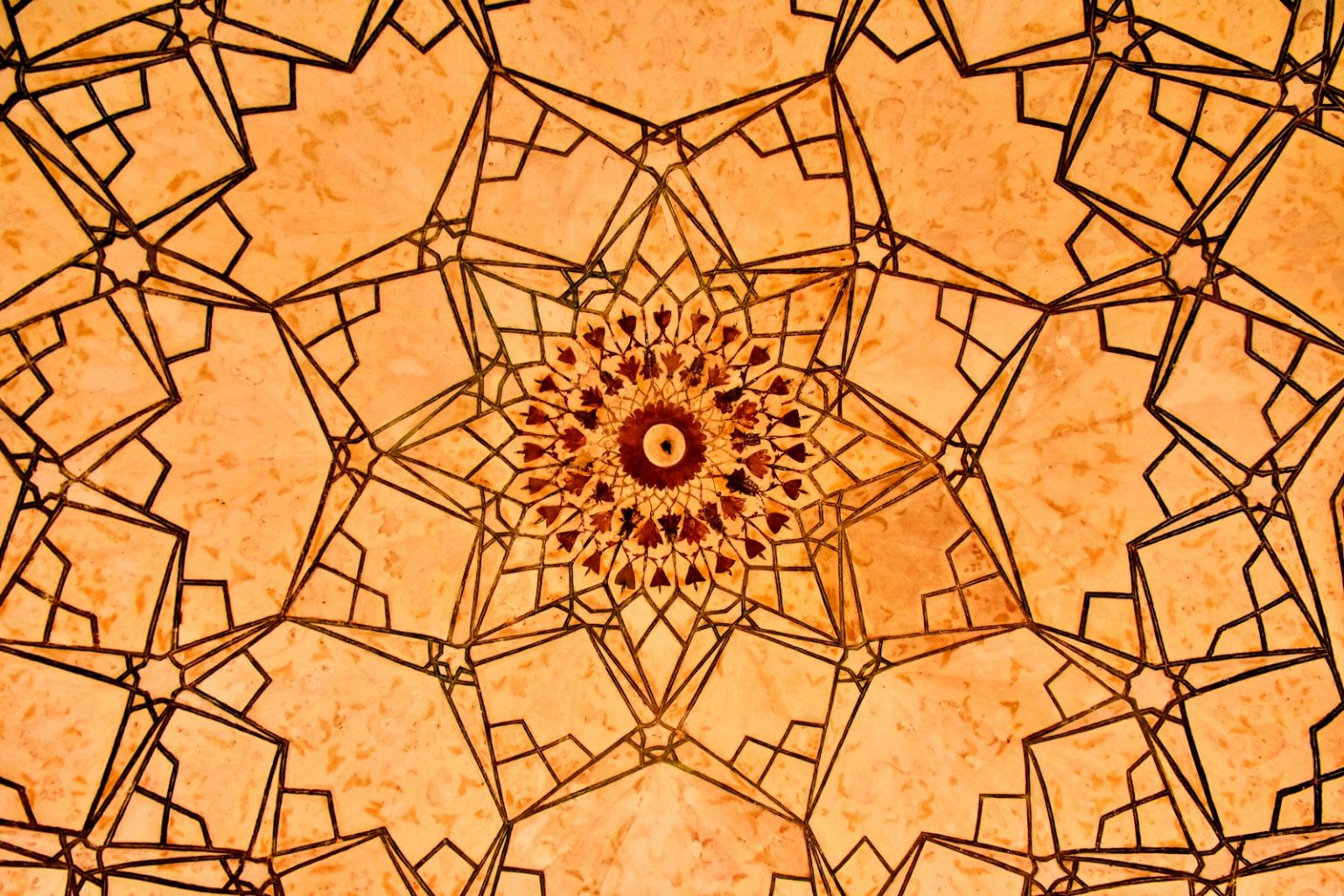 a close up view of a decorative ceiling in a building