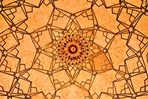 a close up view of a decorative ceiling in a building